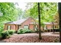 Beautiful single-story brick home with manicured landscaping and inviting front entrance at 260 Emerald Lake Dr, Fayetteville, GA 30215