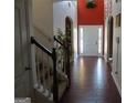 Grand two-story foyer with hardwood floors and decorative archways at 6974 Chilkat Sw Ct, South Fulton, GA 30331