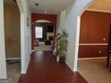 Inviting foyer showcasing archways, beautiful flooring, and a view into the living room at 6974 Chilkat Sw Ct, South Fulton, GA 30331