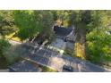 Aerial view of home with nice yard, driveway and street out front at 2228 Emory Sw St, Covington, GA 30014