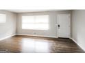 Bright living room featuring pristine hardwood floors and a freshly painted interior at 322 E Rhinehill Rd, Atlanta, GA 30315