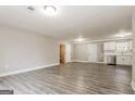 Expansive living room with wood-look floors, featuring a well-lit and open layout at 1427 Timms Se Cir, Atlanta, GA 30316