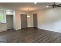 Open living and dining area with new floors, recessed lighting, and closet space at 132 N Johnson St, Bowdon, GA 30108