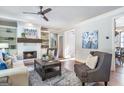 Cozy living room with fireplace, built-in shelves, and comfortable seating area at 8710 Gilmer Ft, Cumming, GA 30028