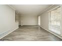 Bright living room with gray walls, new flooring, and natural light from large window at 543 Tahoe Cir, Stone Mountain, GA 30083