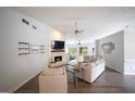 Bright, open living room with a fireplace, modern furnishings, and wood floors at 95 Blue Grass Ct, Oxford, GA 30054