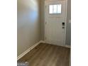 Entryway with durable laminate flooring, painted walls, and a solid front door with glass accent at 3708 Cheswolde Ave # 95, Powder Springs, GA 30127