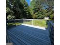 View of the outdoor deck with scenic backyard, perfect for relaxing at 2204 Liberty Sw Ln, Conyers, GA 30094