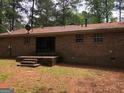 The house has a backyard with a small concrete patio at 7225 Pineneedle Sw Dr, Covington, GA 30014