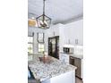 Kitchen features granite countertops, stainless steel appliances, a large island, and stylish modern seating at 2566 Summit Cove Dr, Duluth, GA 30097