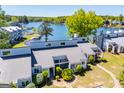 Stunning aerial view of a lakeside townhome community with mature trees and beautiful waterfront views at 294 Clearview Ct, Villa Rica, GA 30180