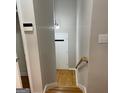 View of an entryway with a hardwood staircase and a white front door at the end of the hall at 1607 Hillview Ave, Jonesboro, GA 30236
