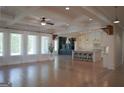 Open-concept living space with hardwood floors, lots of natural light and adjacent kitchen at 368 Ginger Cake Rd, Fayetteville, GA 30214