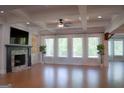 An expansive living area with a cozy fireplace, and large windows at 368 Ginger Cake Rd, Fayetteville, GA 30214