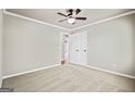 Spacious bedroom with plush carpeting, neutral walls, and a double door closet at 760 Swan Ln, Canton, GA 30115
