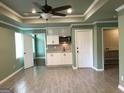 Modern living room with tiled floors, built-in cabinets, and access to outdoor areas at 760 Swan Ln, Canton, GA 30115