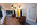 Inviting front porch featuring tile flooring, comfortable seating, and ample natural light at 997 Boulevard Se, Atlanta, GA 30312