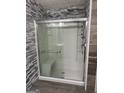 Bathroom shower with glass doors and sleek fixtures, showcasing modern design at 30 Wellington Trl, Covington, GA 30016