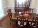 Elegant dining room with a classic wooden table and ornate chairs at 625 Locust Rd, Locust Grove, GA 30248
