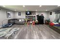 Large living room with a stone fireplace, comfortable seating, and plenty of room for activities at 3456 Village Glen Ct, Snellville, GA 30039
