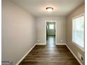 Bright dining room featuring modern floors and a view into the kitchen at 1417 Lavender Nw Dr, Atlanta, GA 30314