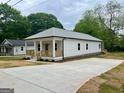 Well-manicured home featuring a lengthy driveway and craftsman style architecture at 304 N Dogwood Ave, Social Circle, GA 30025