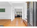 Open foyer with gleaming hardwood floors and a view into the living room at 195 Blackberry Run, Fayetteville, GA 30214