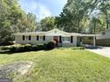 Ranch-style home with a carport and a well-manicured lawn at 6507 Jackie Ln, Austell, GA 30106
