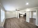 Spacious open-concept living area leads to a bright kitchen with stainless steel appliances at 5906 Pine Hurst Way, Douglasville, GA 30135