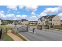 Gated entrance to The Gates at Pates Creek featuring black metal gates and brick pillars at 1816 Quaker St, Hampton, GA 30228