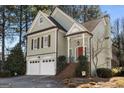 Charming home featuring a brick staircase, red front door, and two-car garage at 5 Renfroe Ct, Decatur, GA 30030