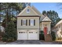 Charming home featuring a brick staircase, red front door, and two-car garage at 5 Renfroe Ct, Decatur, GA 30030