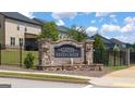 Stone entrance sign for The Gates at Pates Creek, featuring a decorative water feature at 1812 Quaker St, Hampton, GA 30228