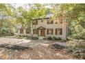 View of the home with new landscaping including black mulch and flowering plants at 185 Chimney Springs, Tyrone, GA 30290
