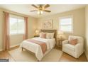Cozy bedroom featuring a comfortable queen bed, soothing decor, and ample natural light from the window at 40 N Villa Rd, Villa Rica, GA 30180