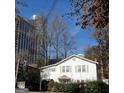 Inviting two-story home showcasing a classic design and serene surroundings at 32 Highland Ne Dr, Atlanta, GA 30305