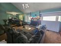Comfortable living room with vaulted ceiling, gray sofa, and view into dining room at 3244 Harbor Woods Rd, Decatur, GA 30034