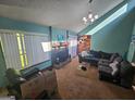 Spacious living room with natural light, fireplace and cozy seating arrangement at 3244 Harbor Woods Rd, Decatur, GA 30034