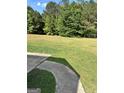 Spacious backyard area with green grass at 5458 Stagecoach Rd, Ellenwood, GA 30294