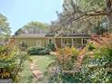 Charming two-story home with a welcoming front porch and beautifully landscaped front yard at 401 Waterwood Bnd, Peachtree City, GA 30269