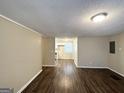 Spacious living room featuring wood flooring and neutral paint at 3332 Ruby H Harper Se Blvd, Atlanta, GA 30354
