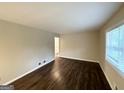 Bright living room featuring hardwood floors and a large window with natural light at 2610 Preston Dr, Decatur, GA 30034