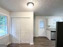 View of modern kitchen with white cabinets, stainless steel appliances, and tile backsplash at 2930 Waters Rd, Atlanta, GA 30354