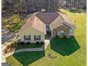 An aerial shot of the charming single-story home and manicured front yard at 425 Wendy Ct, Mcdonough, GA 30252