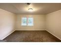 A bright bedroom with carpet flooring and a window at 660 Thomasville Se Blvd, Atlanta, GA 30315