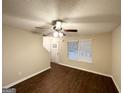 Inviting living room with a staircase, hardwood floors, ceiling fan and natural light at 263 Coral Cir, Mcdonough, GA 30253