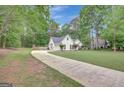 Suburban home with long driveway and ample green space at 35 Wenham Ln, Sharpsburg, GA 30277