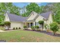 Inviting exterior showcasing manicured landscaping and classic architecture at 35 Wenham Ln, Sharpsburg, GA 30277