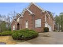 Lovely two-story brick home featuring an attached three-car garage and a well-manicured front lawn at 1442 Swiftwater Cir, Mcdonough, GA 30252