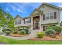 Charming two-story home with well-maintained landscaping, complemented by a welcoming front entrance at 1484 Stephens Pond Vw, Loganville, GA 30052